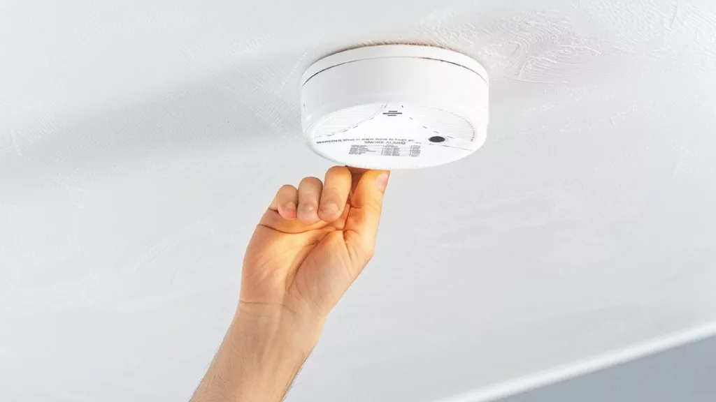 Smart smoke detector integrated with alarm system